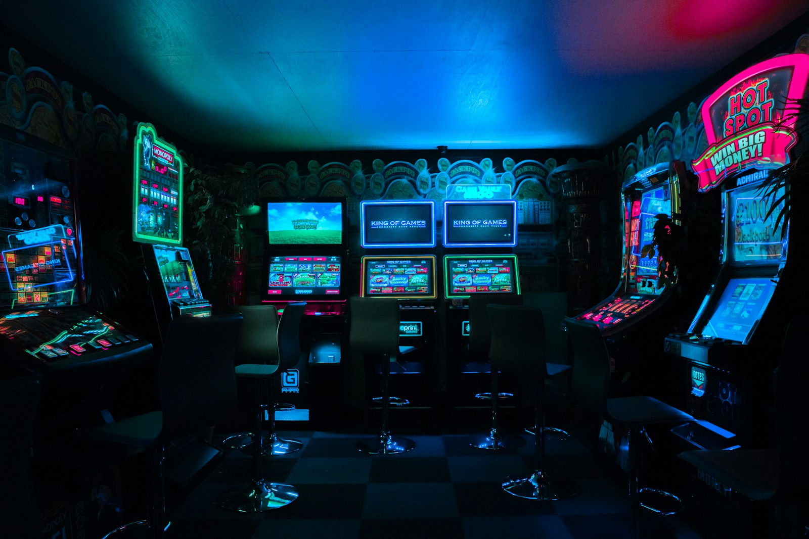 Atmospheric arcade illuminated with neon lights